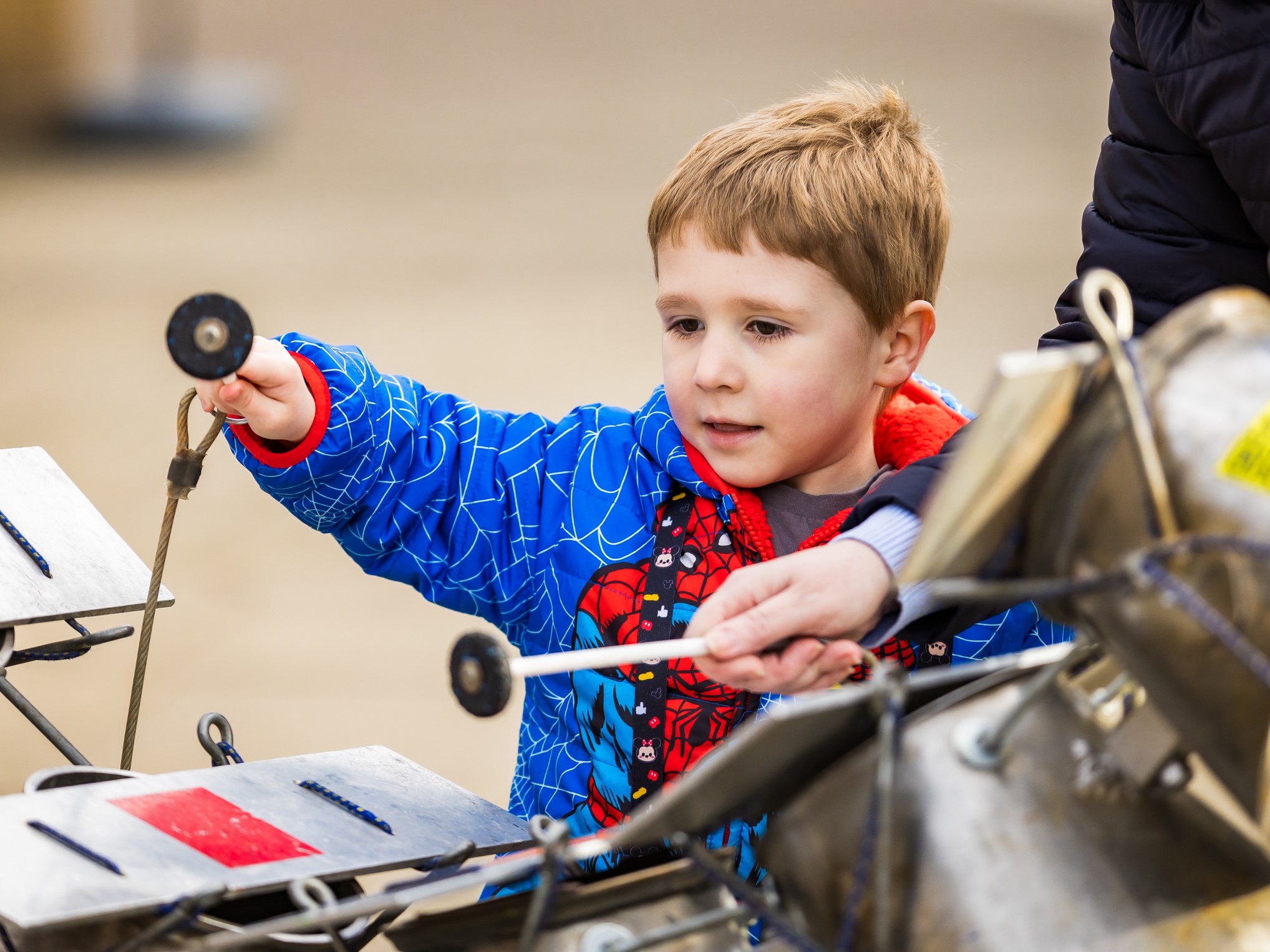 A young boy near some instruments.