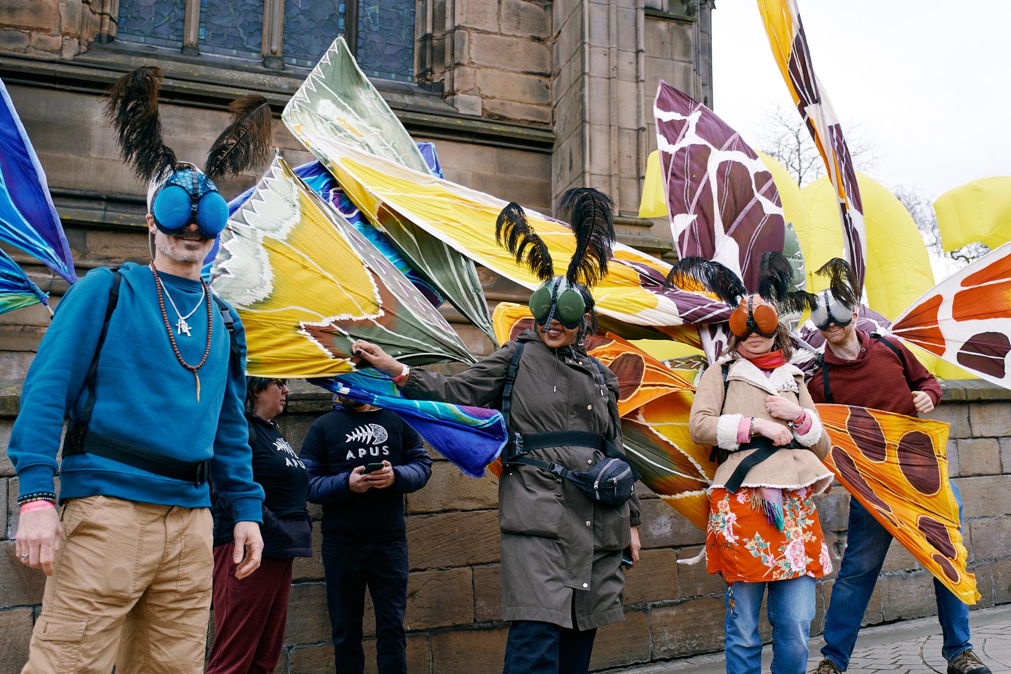 People dressed up as butterflies at Roots Rotherham Street Carnival