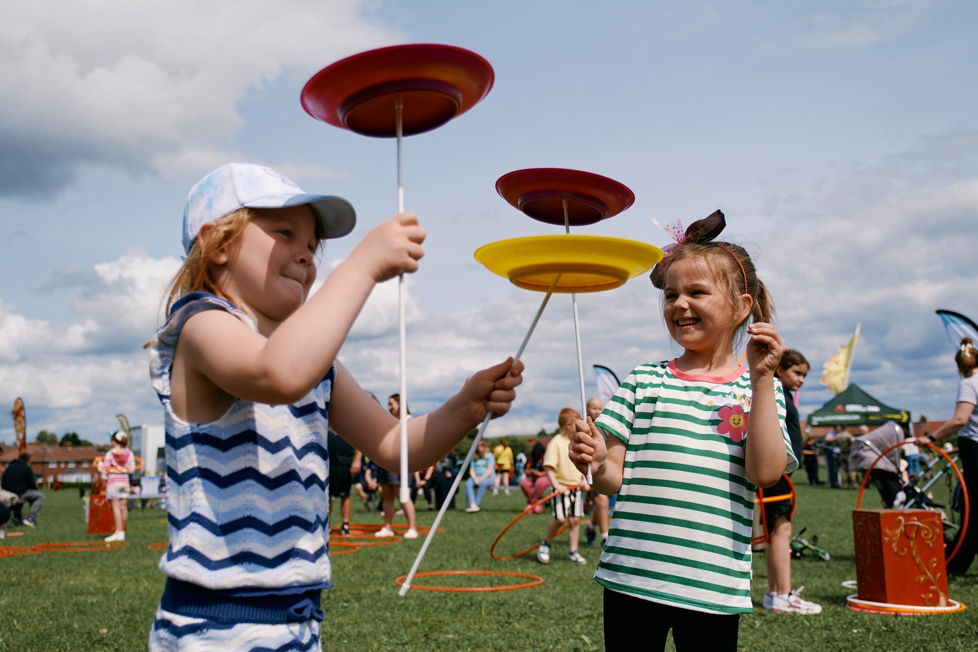 Girl drawing a face in a red circle at the Whiston Gala
