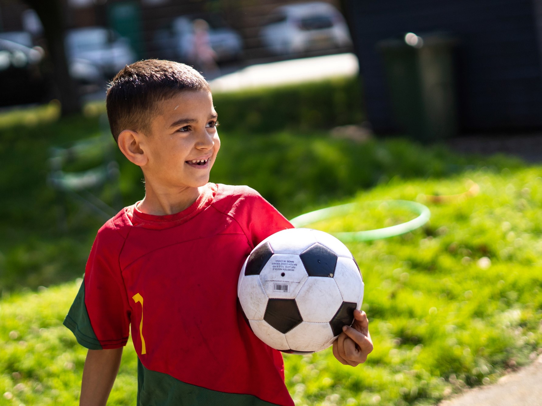 A boy holding a football.