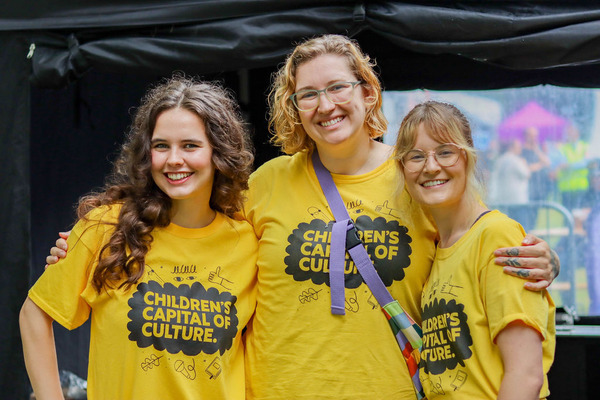 3 CCoC members smile for the camera.