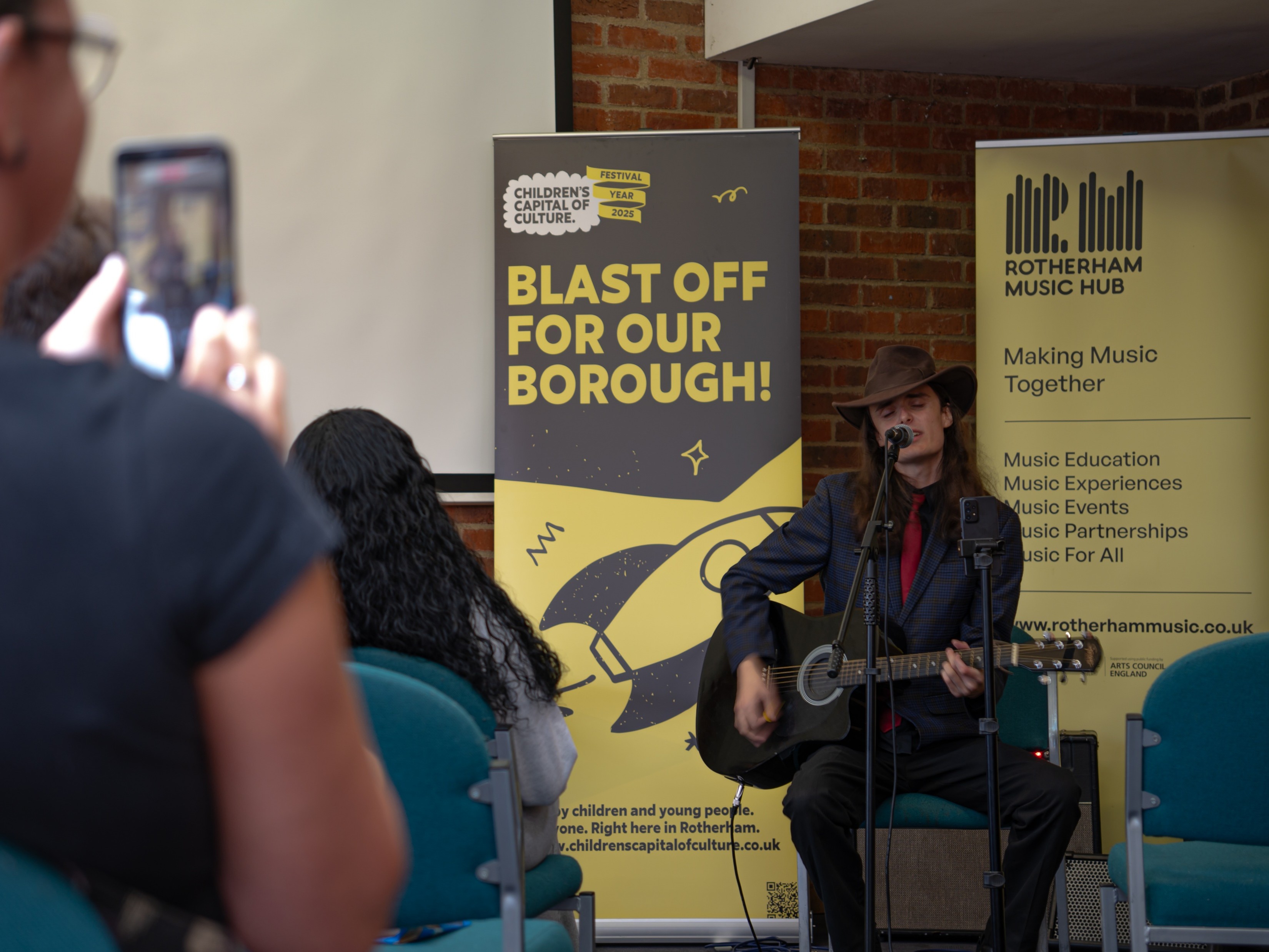 Someone speaking in to a microphone.