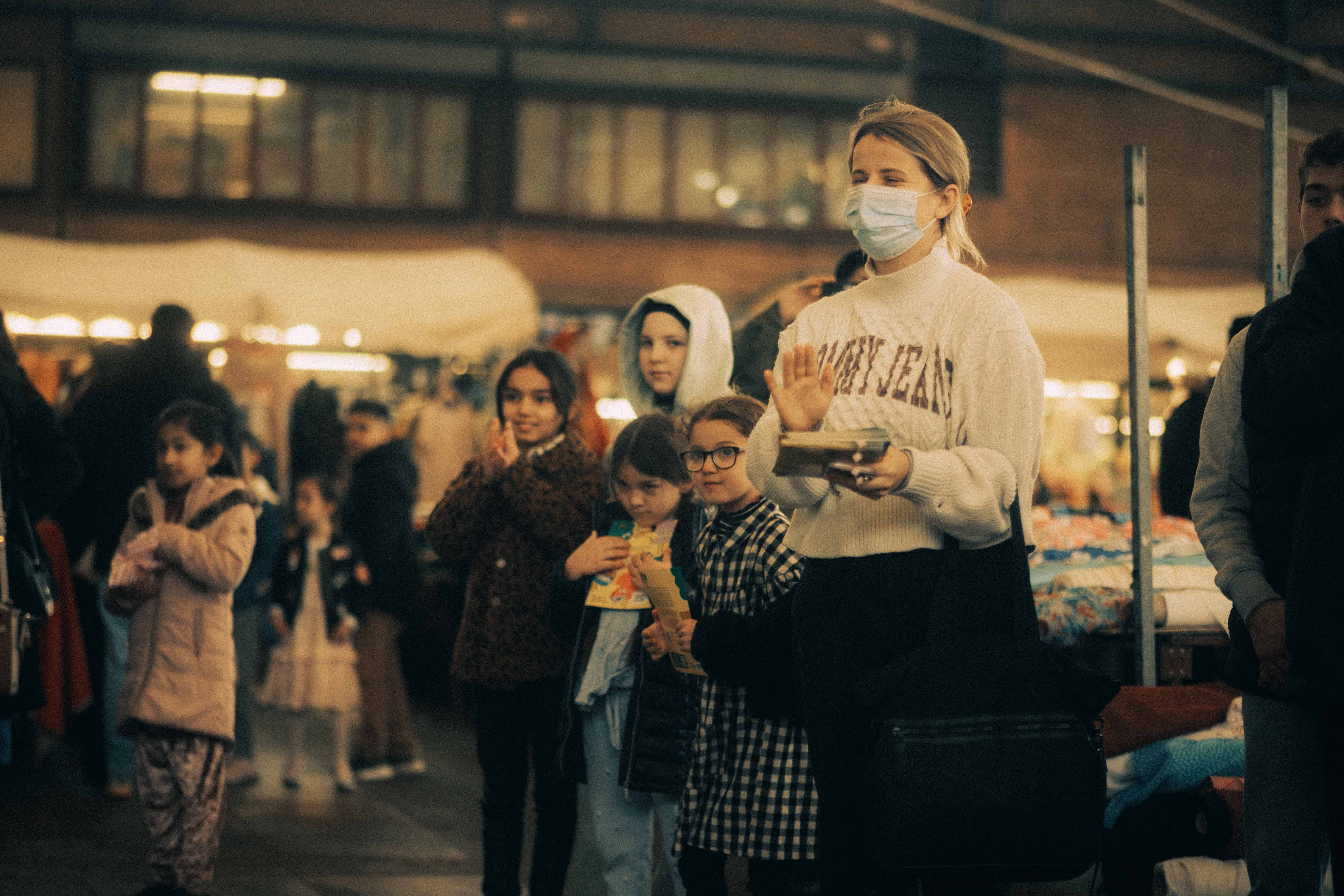 Crowd watching a performer at the Rotherham Bazaar