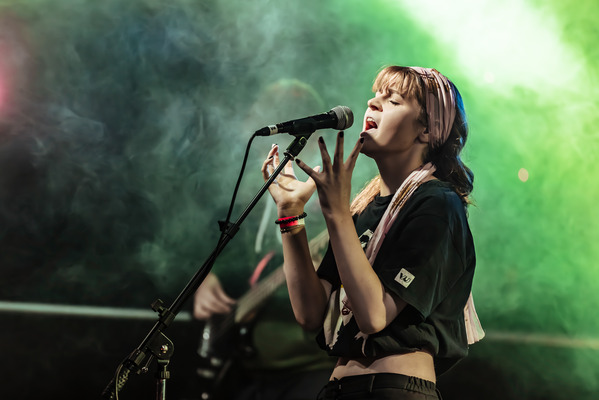 A musician performing on stage.