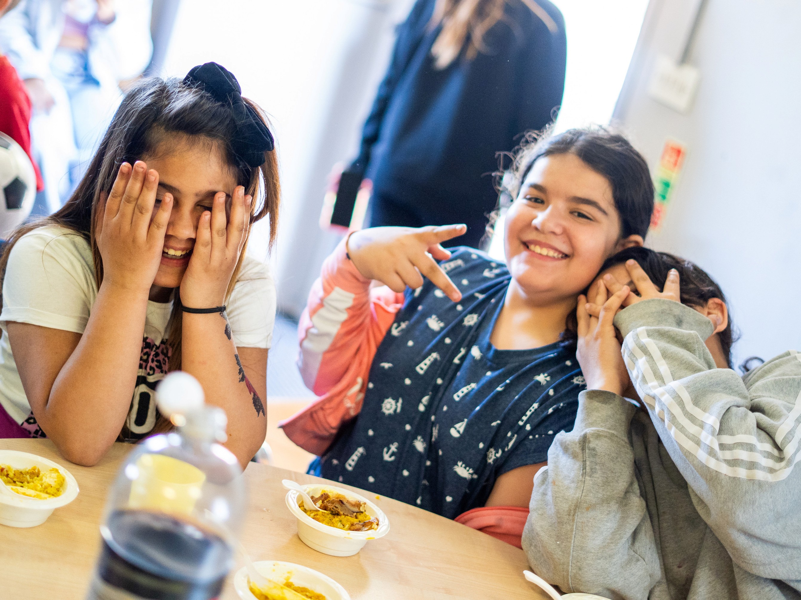 Smiling people sat at a table