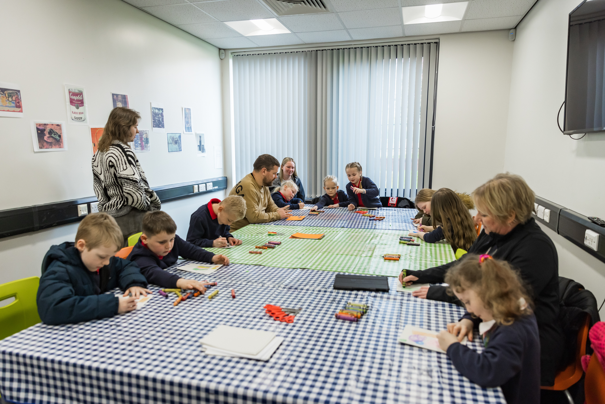 Children doing a tabletop activity at Art Explora