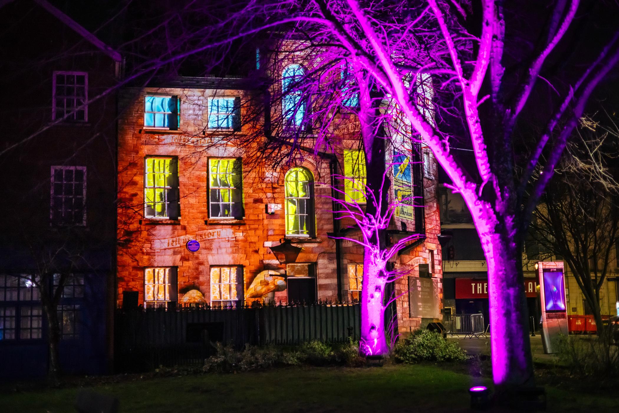 Projections on building in town centre at Otherham
