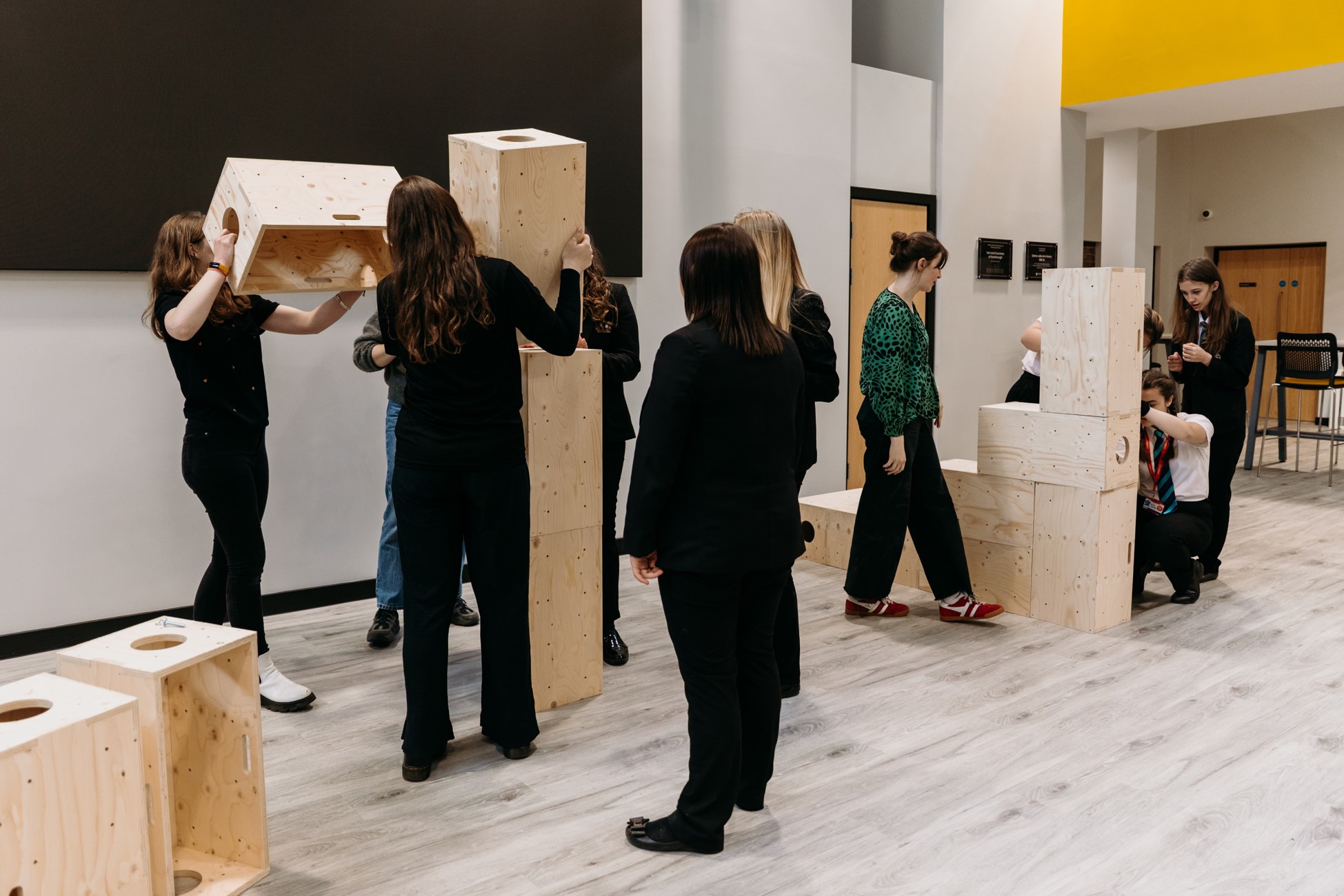 People stacking boxes.